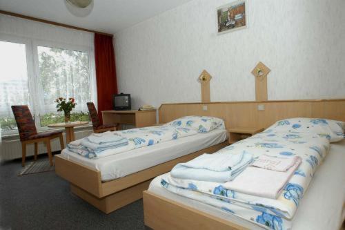 Chambre Triple (1 Lit Double et 1 Lit Simple)