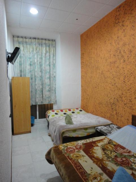 Chambre Quadruple avec Salle de Bains Commune