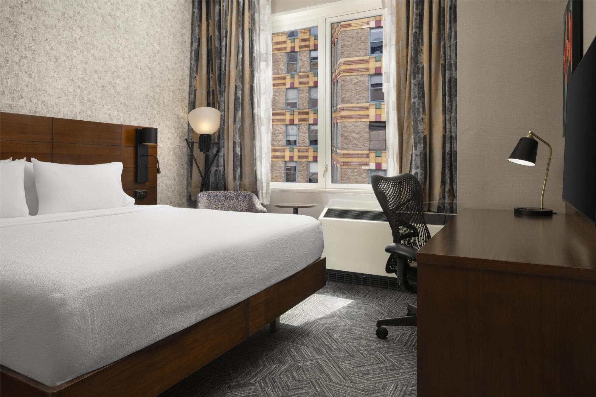 Chambre Lit King-Size avec Baignoire Accessible aux Personnes à Mobilité Réduite